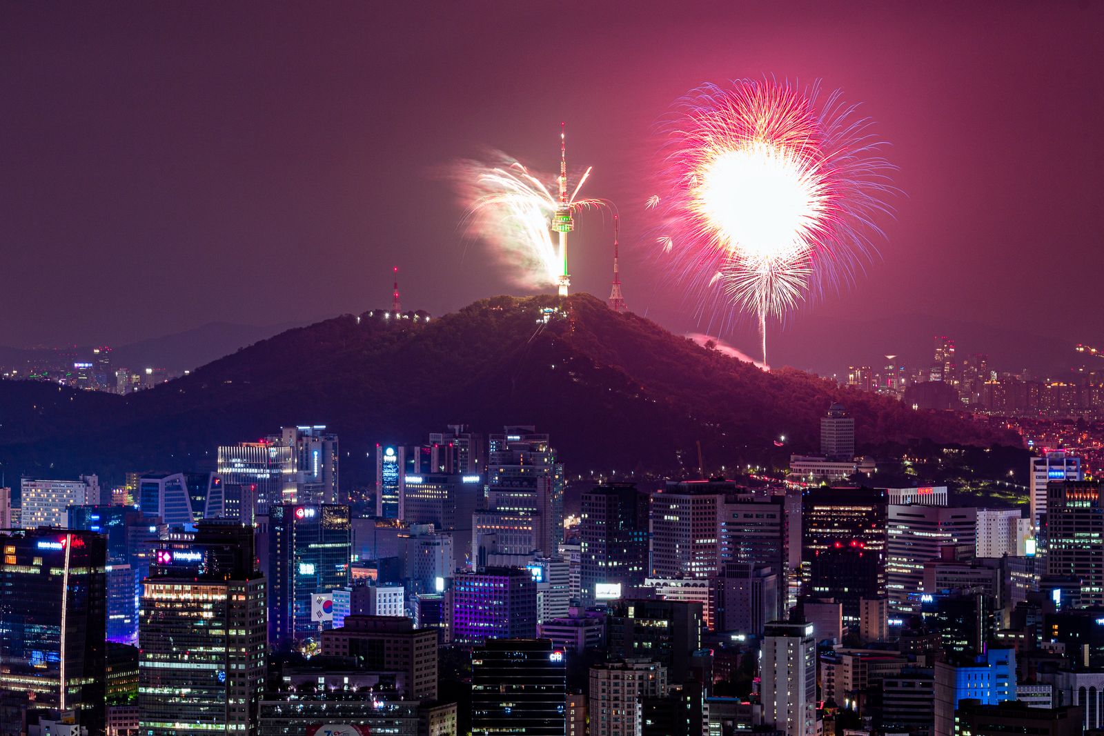 Fireworks over a mountain in Seoul at night